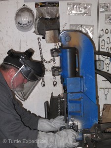 Mike Marks used special hydraulic ram to cut chain links to the desired length.