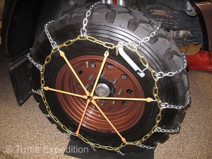 Pewag's new Multi-Arm chain tighteners are an easy way to keep chains snug on the tire.