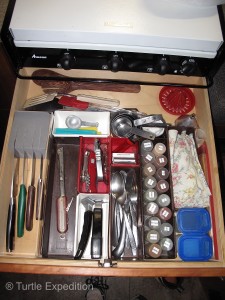 Organization and maximum use of space is critical in a small camper. 35mm film cans held spices that can be refilled as needed from the “pantry”.