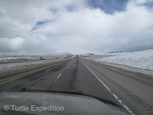 Blowing snow and darkening clouds gathered in the distance.