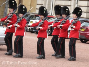Based on the number and placement of buttons and the color of the plumes on their bearskin hats, we, as experts, knew that these were Welsh Guards, maybe.