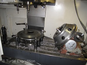Computerized CNC machines are used for precise machining of center holes and lug nut holes.