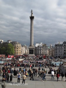 London is a MAJOR tourist attraction. Note the five red buses in the background on famous Trafalgar Square with Lord Nelson’s statue honoring his major victory against the French and Spanish armada in 1805.