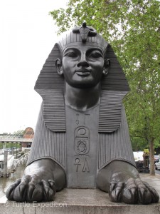 Two of these bronze sphinxes watch over the Egyptian obelisk, which had laid prostrate for centuries in the sands of Alexandria before being presented to the British Nation in 1819.