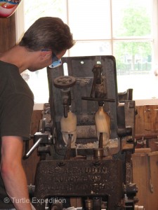 Using a pattern for each size, old belt-driven machines do much of the basic shaping of the clog.
