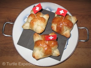 Bakeries sell August 1 bread decorated with tiny Swiss flags.