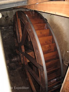 The old waterwheel under the shop still turns, but today the power comes from electric motors.