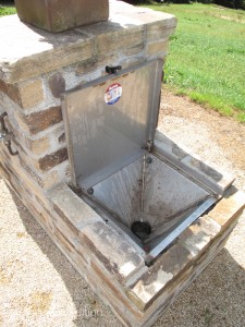 The clever black water dump device had a flush button like a toilet. On the opposite side there was a fresh water fill spigot.