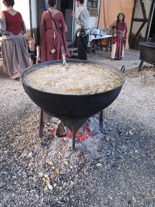 Tantalizing kettles of stew bubble over open fires waiting for hungry visitors.