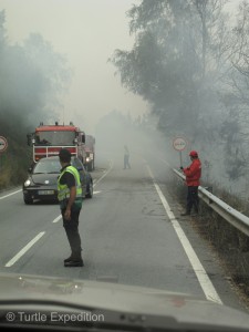 Fires burning in the mountains created some dense smoke. In places the flames were along side the road.