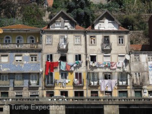 Life goes on along the old-world riverfront district, now a UNESCO World Heritage site.