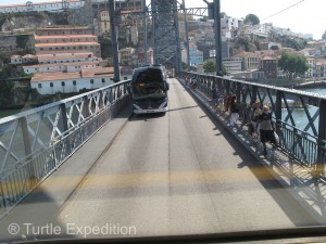 Passing a big bus on a narrow bridge can be exciting.