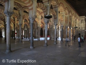 The interior of the Mezquita (Cathedral) is a forest of arches and marble pillars.