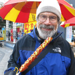 Gary is enjoying his giant hot dog.