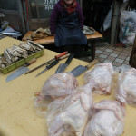 Fresh chicken! Really fresh. They were plucking these the first time we walked by.