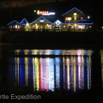 Village lights shimmered across the little harbor.