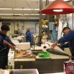 In the operating room, fresh fish are expertly prepared for the market.