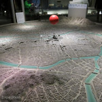 This model shows the city of Hiroshima and the red fire ball indicates the location where the A-bomb was dropped.