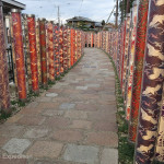 At the Saga Arashiyama train station outside Kyoto, artfully displayed kimono fabric columns lead to the Pond of Dragon, an interesting fountain with a spinning ball balanced on water.