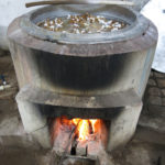 The tied silk threads are sitting in a hot dye bath for quite some time.