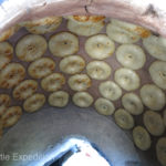 When the dough is shaped, each piece is individually slapped onto the wall and ceiling of the oven until it is baked to a golden brown.