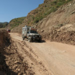 When the pavement ended the dirt track was often only one lane with the occasional turnout. This landslide had recently been cleared.