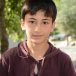 We wondered if this young boy knew why we were smiling at his T-shirt.