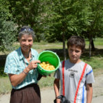 We bought a half a bucket of ripe apricots from kids on the side of the road.