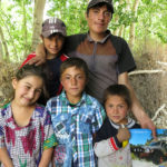 Villagers along the roadside were always friendly and excited that we had come all the way from California to see them.