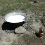 Women were preparing fresh yogurt or cheese over an open fire.