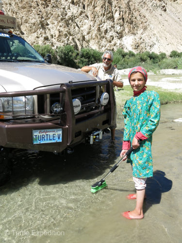 We had just started to wash the truck when this young girl walked into the water, took the brush from my hands and started to help. We were amazed.