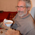 Gary is tasting the local salty milk tea and thin bread.