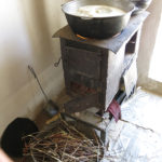 During our visit, the women's hands were busy and the soup was cooking on the stove.
