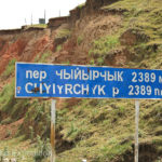 Another road sign. Yes, we were going downhill. 2,389 m/7,837 ft.