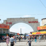 The entry into the Osh Bazar was impressive. Zoom in and you will notice that the dress code is very western for both men and women.