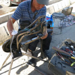 This sidewalk shoe repair man was happy to alter the seat belt strap we needed for the third seat in our truck for our Chinese guide.