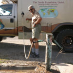 Heading out of town we spotted a neighborhood water faucet and hooked up our handy water thief for a fast fill-up.