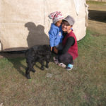 Tursun, our host & the owner of this home-stay “yurt hotel” called Sabrybek's Yurt Camp, poses with her daughter.