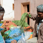 This street vendor had some nice fresh green beans and other vegetables probably picked that morning.