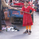 This young girl had her street sweeping job under control.