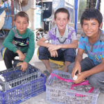 These guys were walking the market selling sunflower seeds, a popular snack.