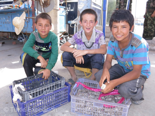 These guys were walking the market selling sunflower seeds, a popular snack.