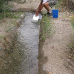 An irrigation ditch gave us a good place to refill our water tank and take a hot shower.