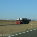 These monster Chinese over-the-road semi-trucks have as many as 12 axles and 20 wheels on the ground. Water-cooled brakes are a help.