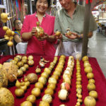 This lady was happy to show off her various decorated gourds.