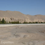 The Dachuan River passes by the cliffs of the once thriving Mogao Buddhist Community.