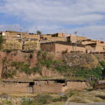 Some rooftops were carefully stacked with firewood. Special racks were used for drying grain before threshing started.