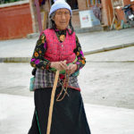 Tibetan Buddhist Pilgrims: We had never seen so many people with canes and brand new tennis shoes.
