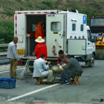 A road crew takes their lunch break very seriously.