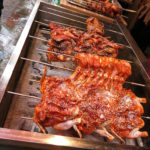 Barbecued chicken seasoned with spicy sauce and sesame seeds looked tasty.